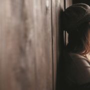medium shot girl posing near wall